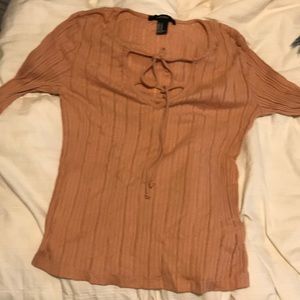 Long sleeve pink shirt.